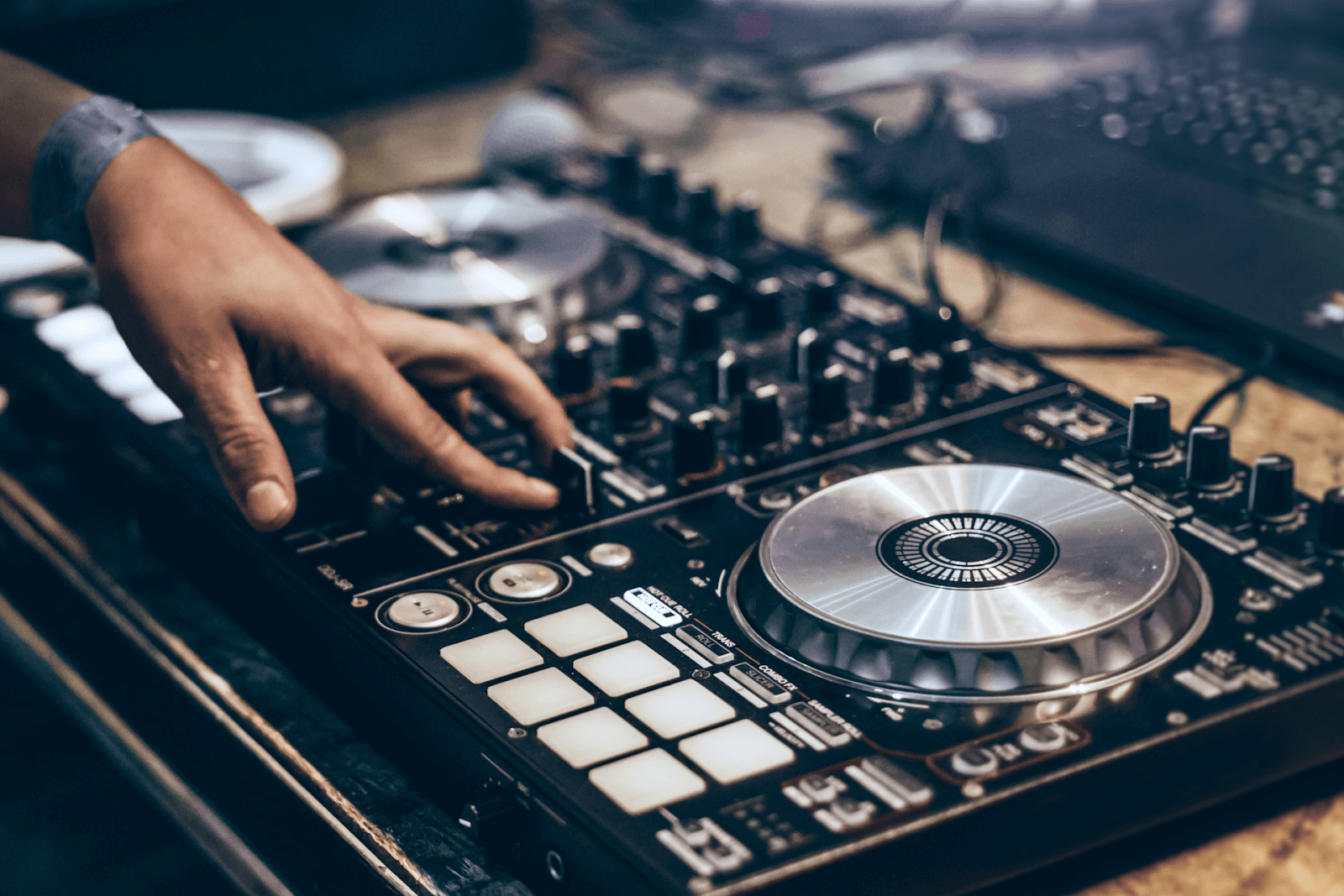 Someone mixing music on a turntable